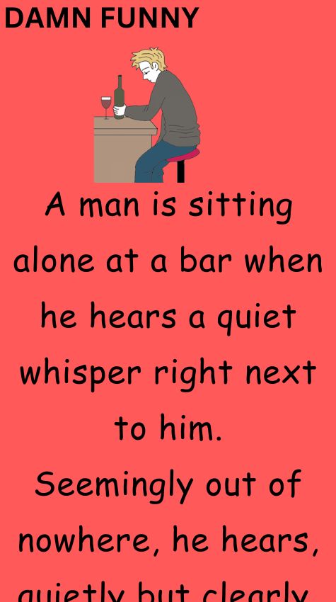 A man is sitting alone at a bar
