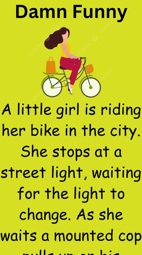 A little girl is riding her bike in the city